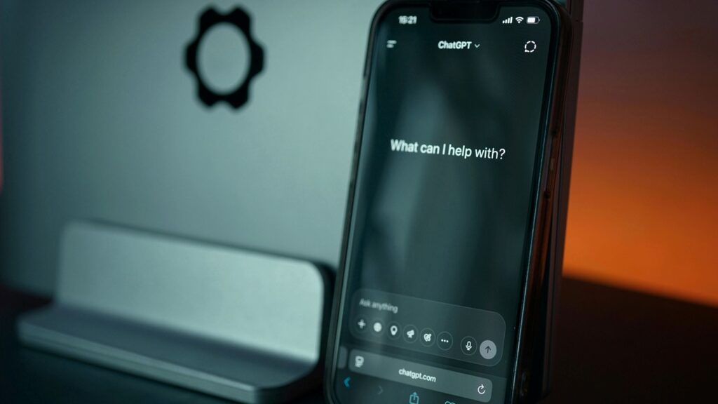 A phone on a desk displaying a ChatGPT interface, symbolising the use of AI tools for research and personalised beauty consultations.